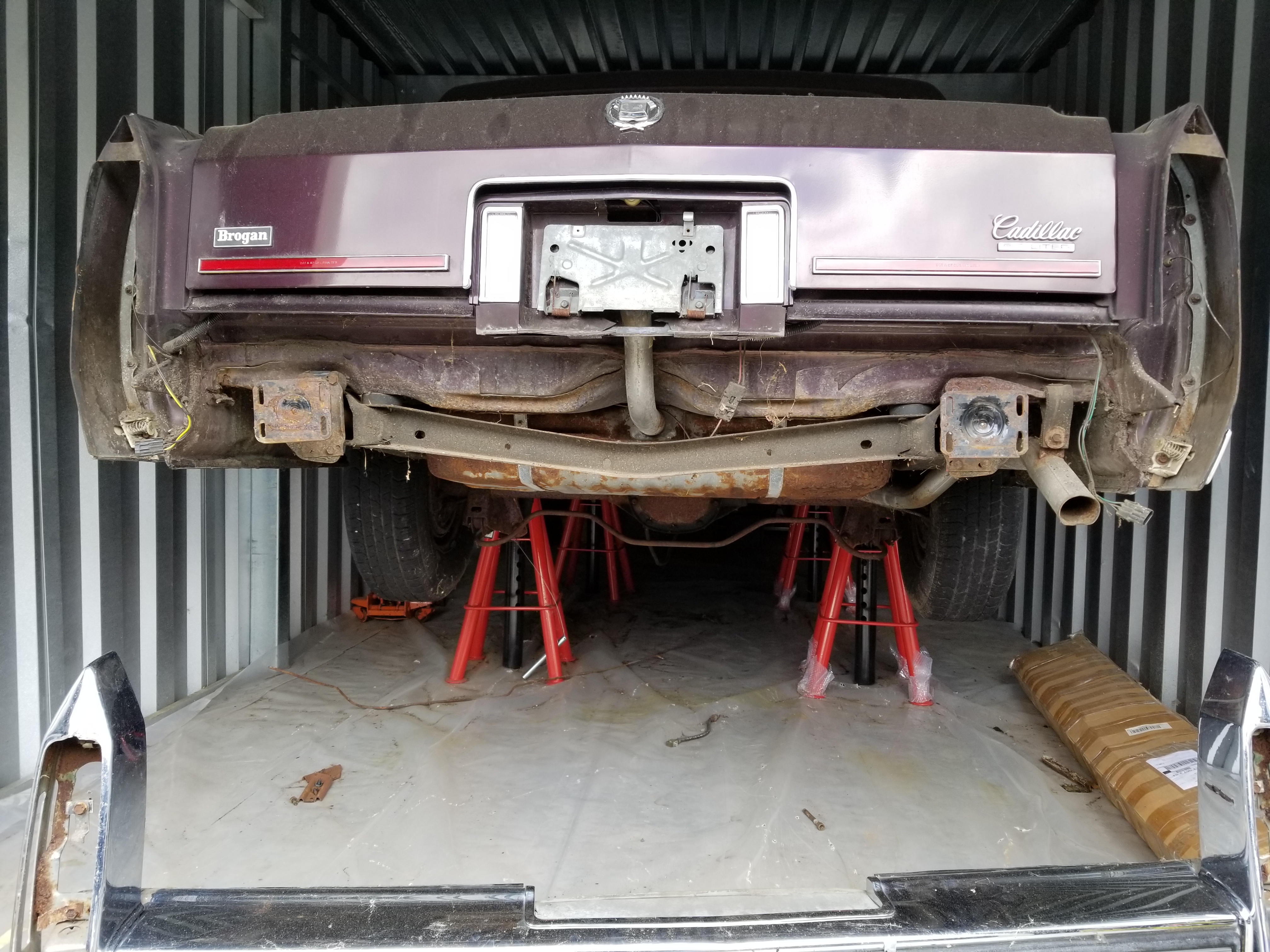 Cadillac on tractor jack stands.jpg