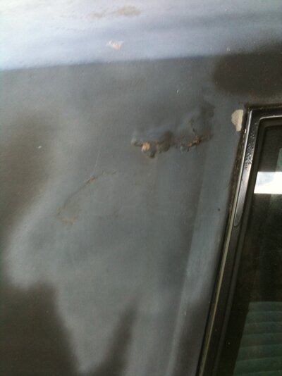 Quarter window rust.JPG