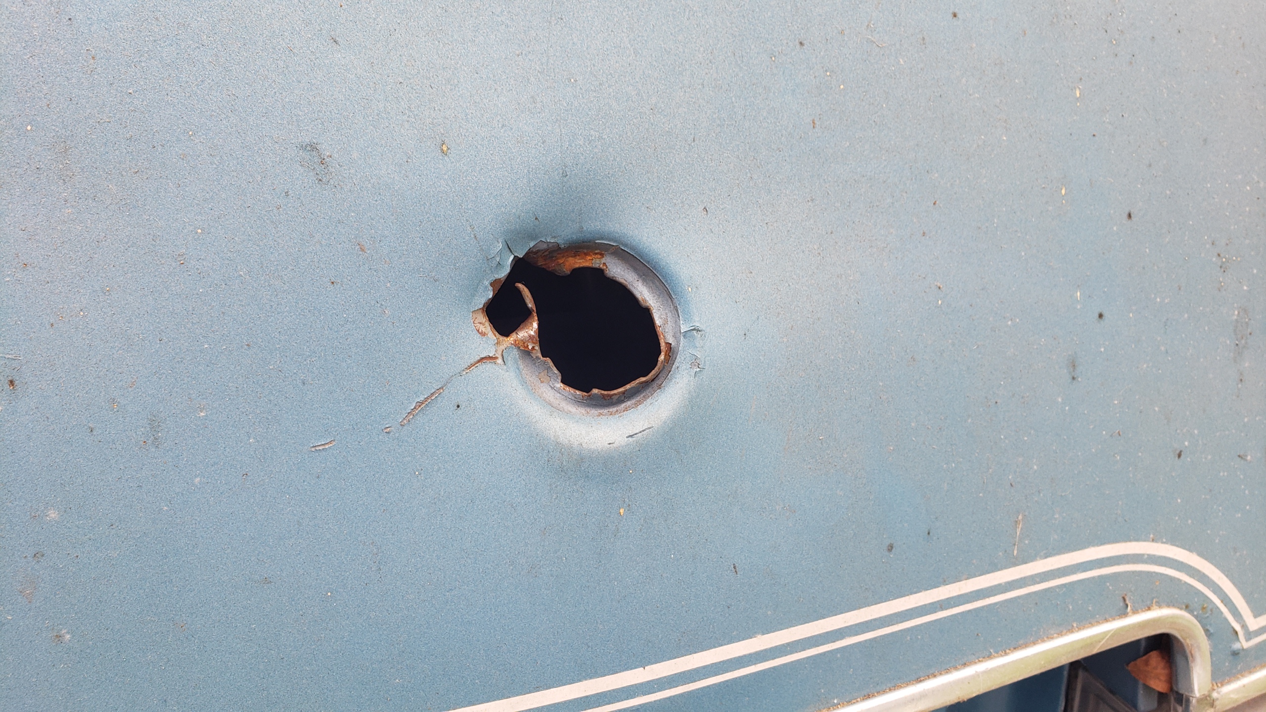 Trunk latch hole